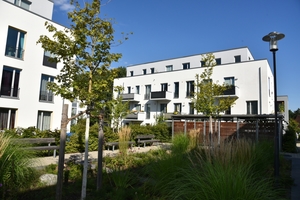  Auch im zweiten Bauabschnitt schreibt die Anlage aus Niedrigenergiehäusern die Gartenstadtidee des grünen Wohnens für das 21. Jahrhundert fort 