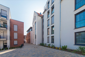  Unter Erhalt des Grundcharakters der Brauereigasse fügt sich die kleinteilige Anlage in den Stadtkern ein 